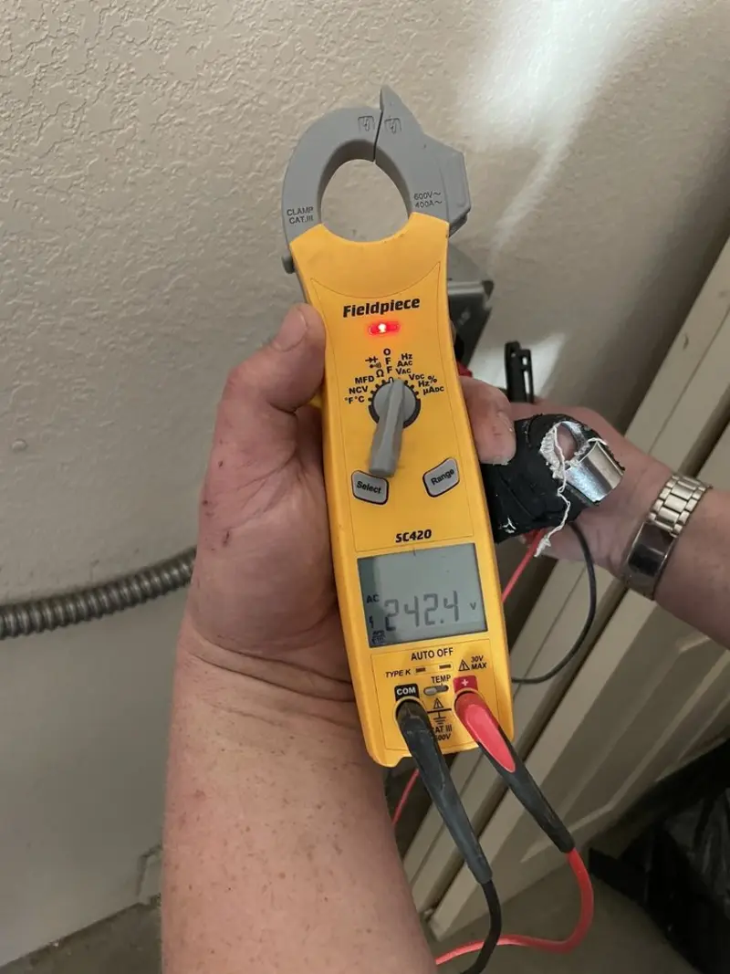 Voltage testing with clamp meter during Ceiling Fan Installation in Mount Holly